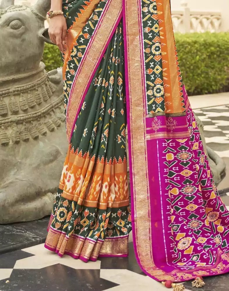 Gorgeous Dark Green Floral Patola Saree