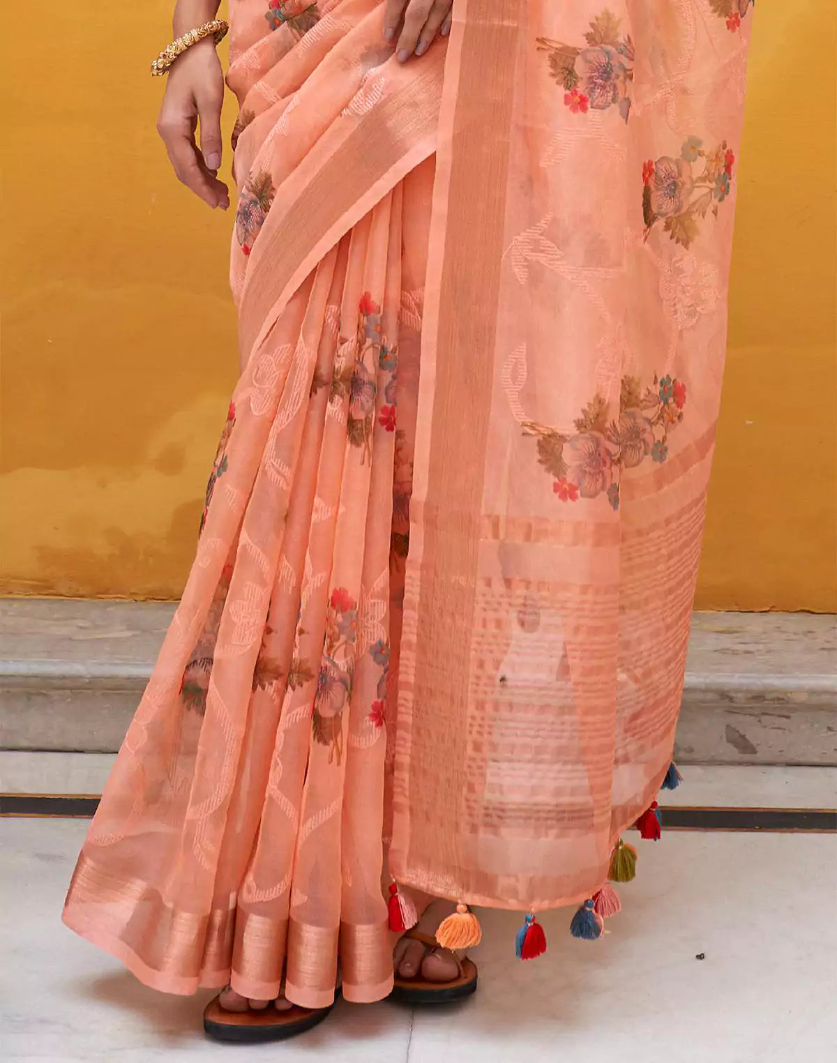 Peach Organza Floral Print Saree With Tussels and Contrasting Blue Blouse