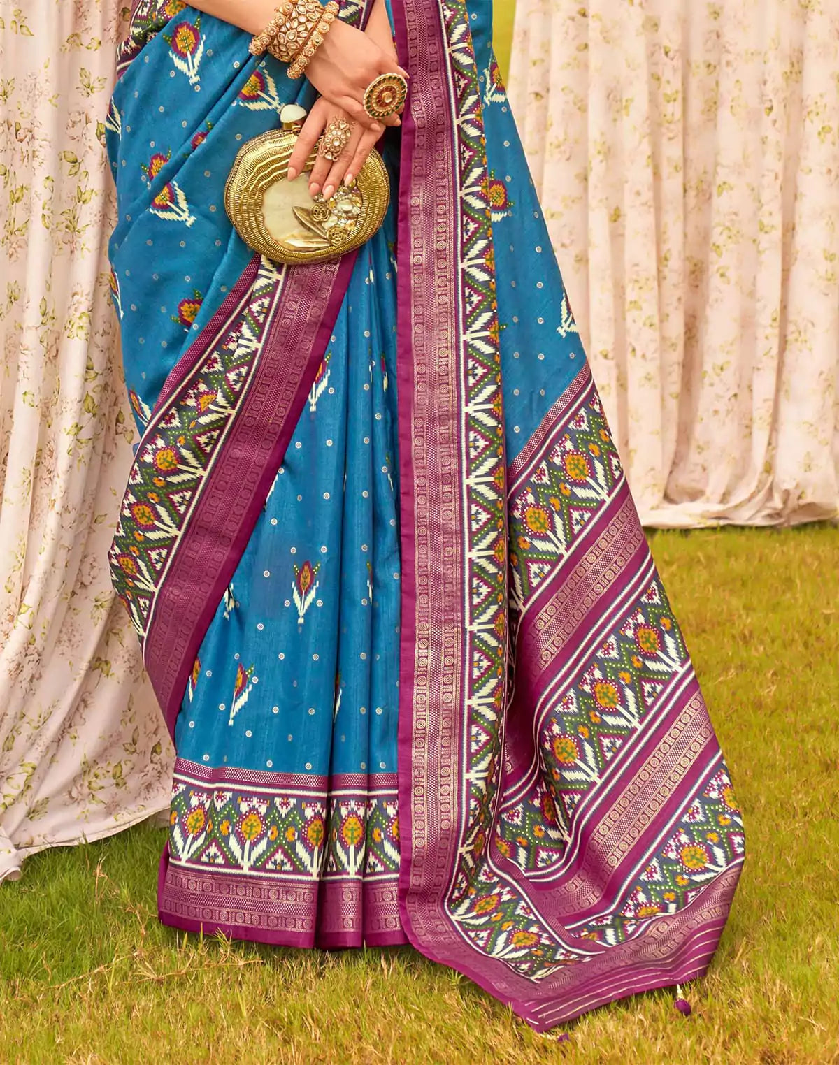 Captivating Blue Patola Silk Floral Festive Wear Saree
